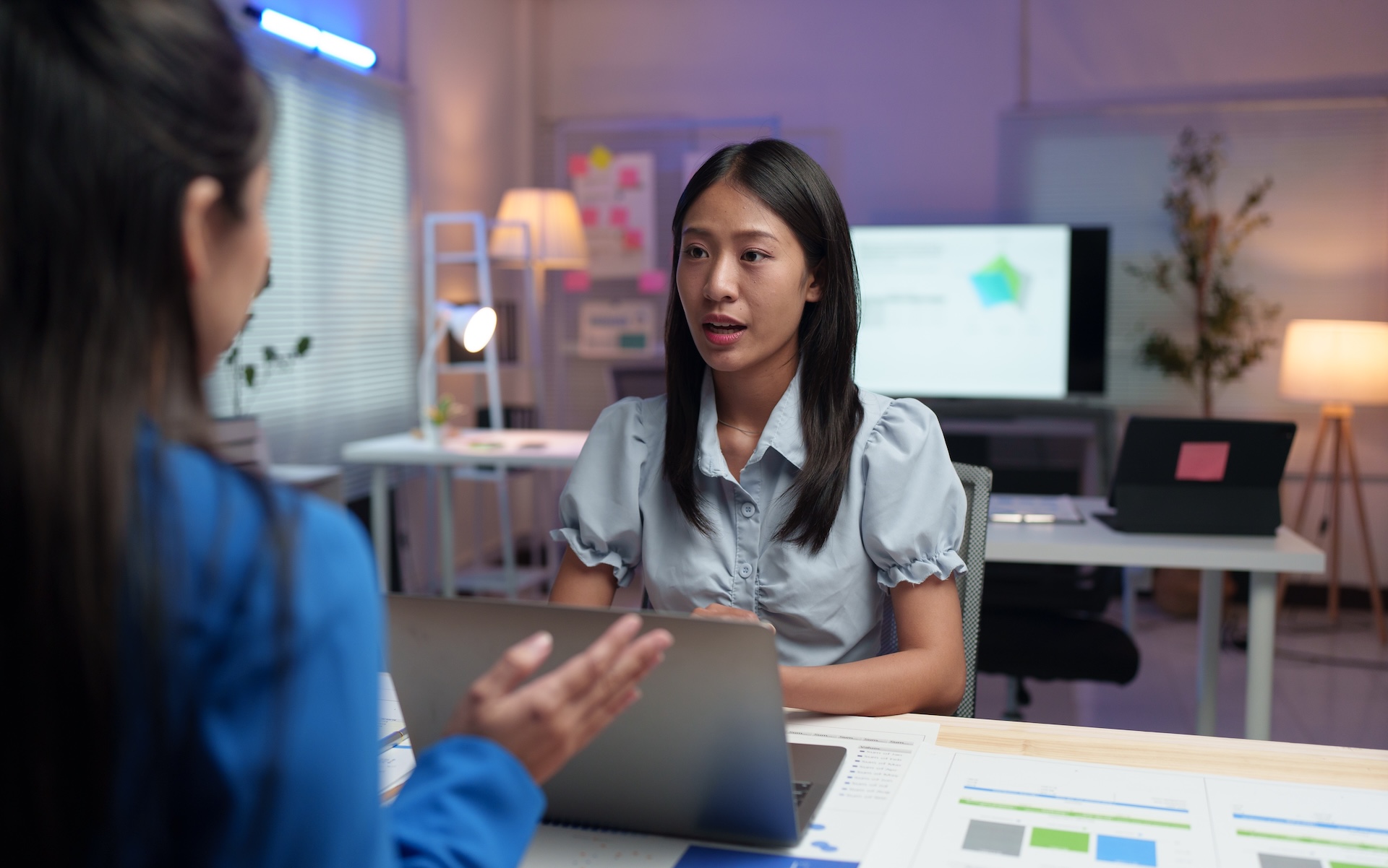 employees and coworkers work together in the office Talking and giving advice 