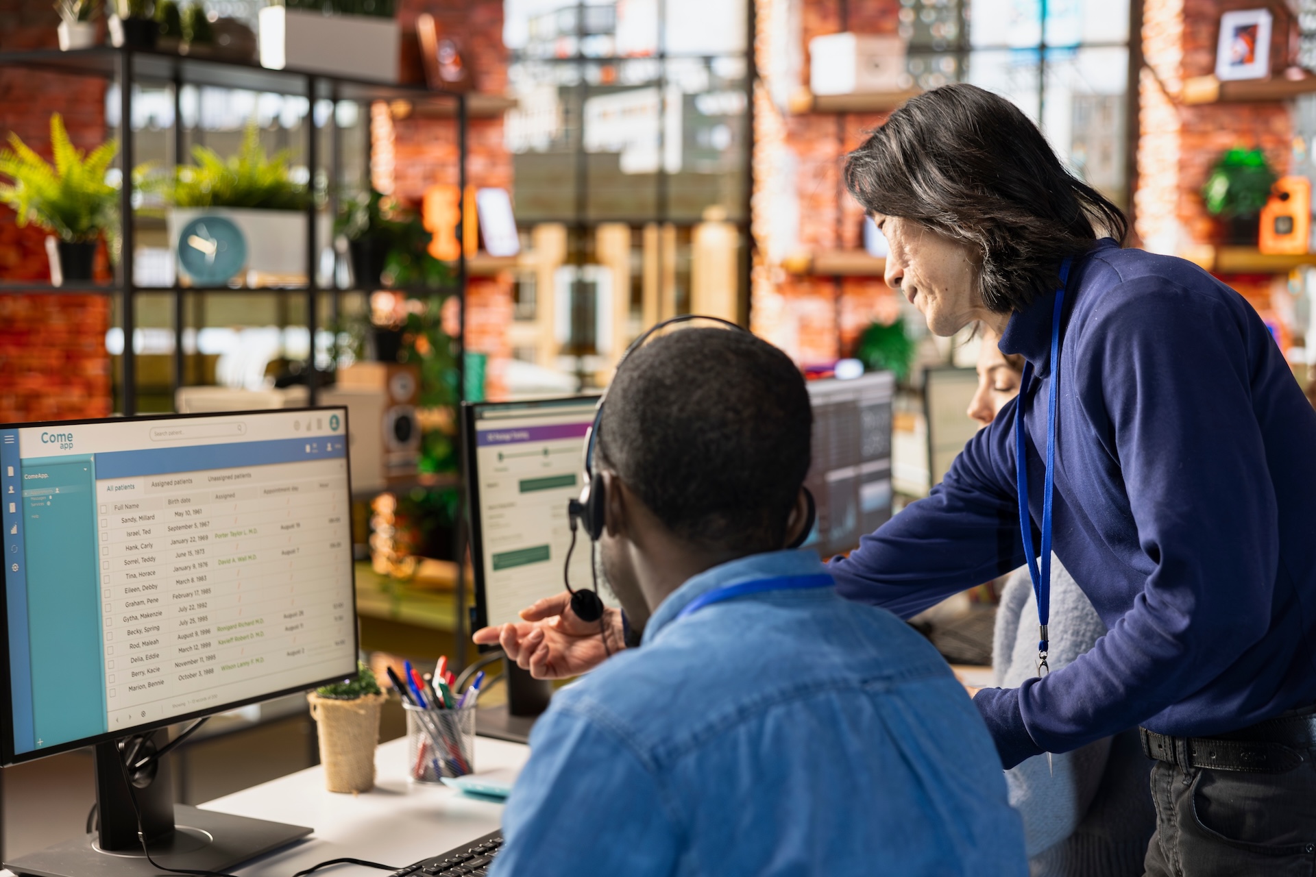 Team of call center agents tracking shipments in office, handling delivery delays. 