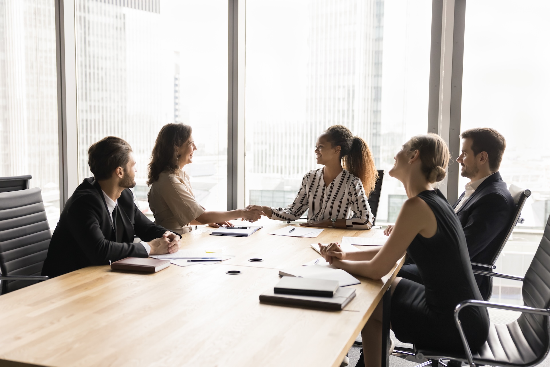 Collaboration between generations. Experienced employee expert on team briefing appreciate for help professional advice